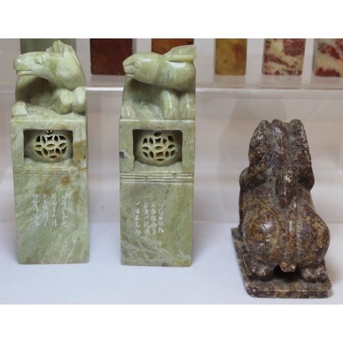 277 - Collection of eight Chinese carved stone seals with various finials in the form of figures and mythi... 