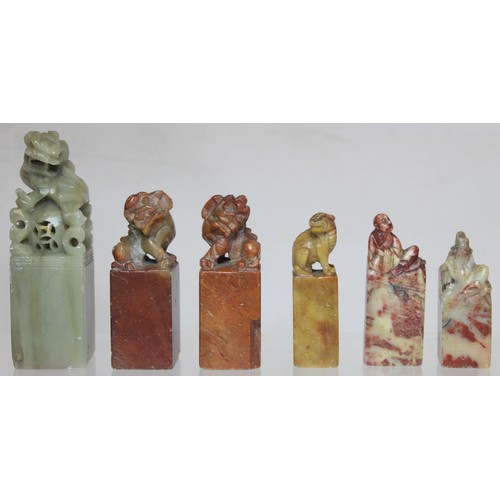 277 - Collection of eight Chinese carved stone seals with various finials in the form of figures and mythi... 