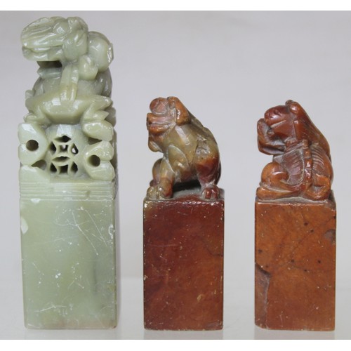 277 - Collection of eight Chinese carved stone seals with various finials in the form of figures and mythi... 