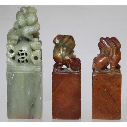 277 - Collection of eight Chinese carved stone seals with various finials in the form of figures and mythi... 