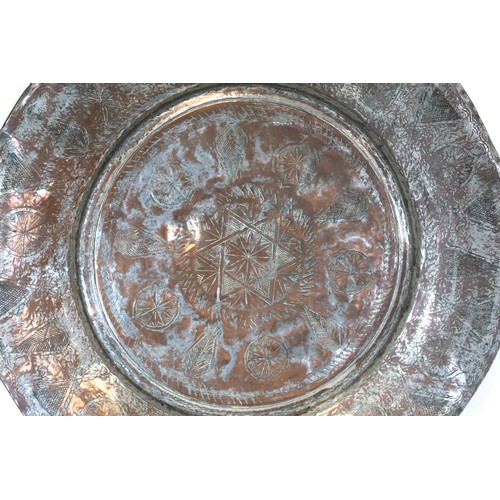 278 - 19th century large Eastern tinned copper circular charger with incised central flowerhead star medal... 