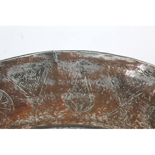 278 - 19th century large Eastern tinned copper circular charger with incised central flowerhead star medal... 