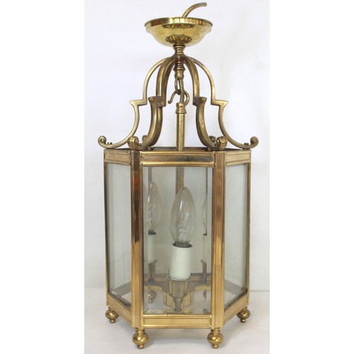 280 - Georgian style brass hall lantern of hexagonal form with bevelled glass panels, domed scroll support... 