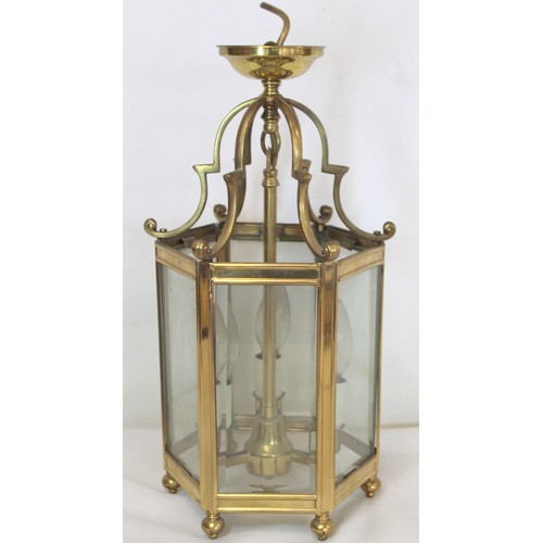 280 - Georgian style brass hall lantern of hexagonal form with bevelled glass panels, domed scroll support... 