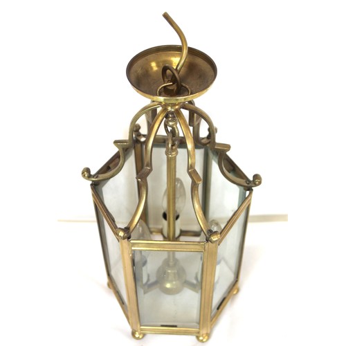 280 - Georgian style brass hall lantern of hexagonal form with bevelled glass panels, domed scroll support... 