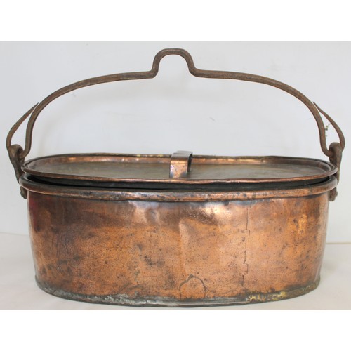 281 - Large 19th century copper fish kettle of oval form with swing handle and lift-out trivet, 61cm long.