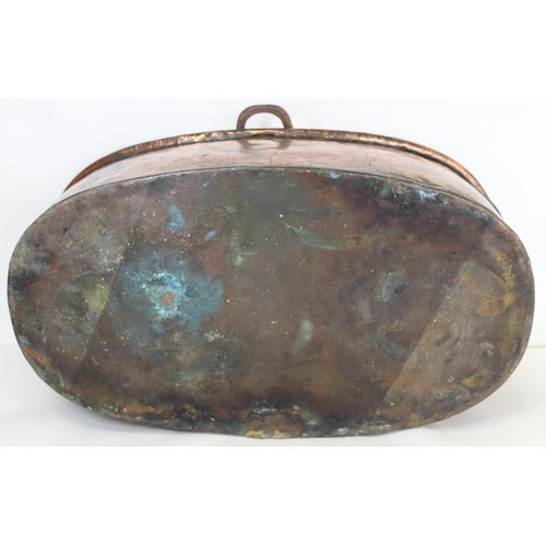 281 - Large 19th century copper fish kettle of oval form with swing handle and lift-out trivet, 61cm long.