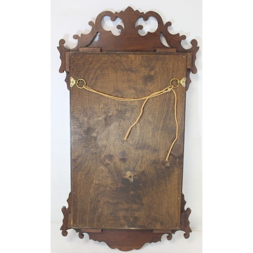 284 - Georgian style walnut veneered wall mirror with fret cut frame, 68cm high.