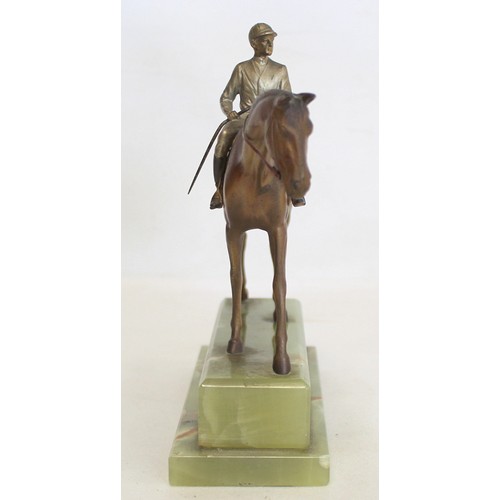 301 - Early 20th century Austrian cold painted bronze figure of a racehorse and jockey on stepped green on... 