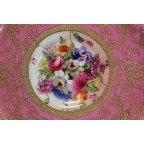 304 - Royal Worcester cabinet cup and saucer with polychrome painted floral panels surrounded by pink and ... 