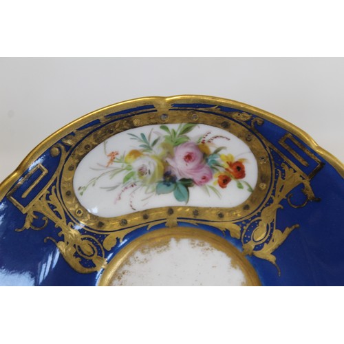 304 - Royal Worcester cabinet cup and saucer with polychrome painted floral panels surrounded by pink and ... 