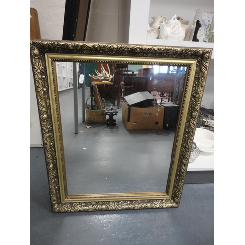 86 - Ebonised wall mirror and a gilt wall mirror.