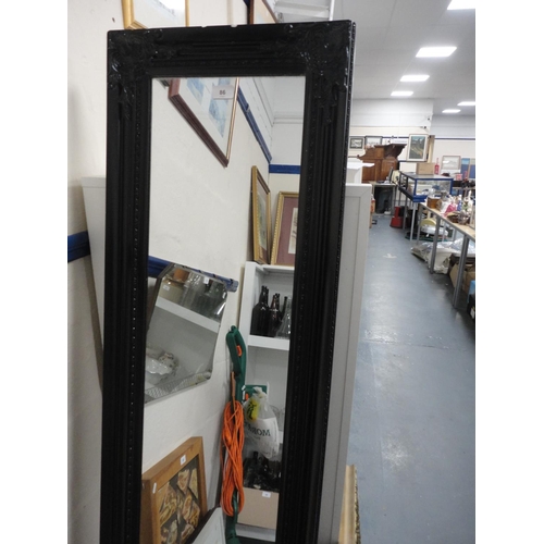 86 - Ebonised wall mirror and a gilt wall mirror.