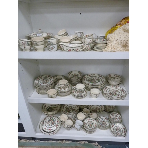 102 - Large quantity of Johnson Bros Indian Tree dinnerwares, also an Indian tablecloth (three shelves).
