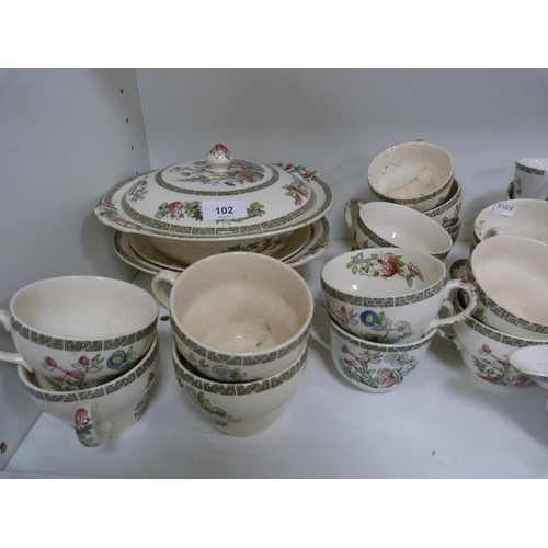 102 - Large quantity of Johnson Bros Indian Tree dinnerwares, also an Indian tablecloth (three shelves).