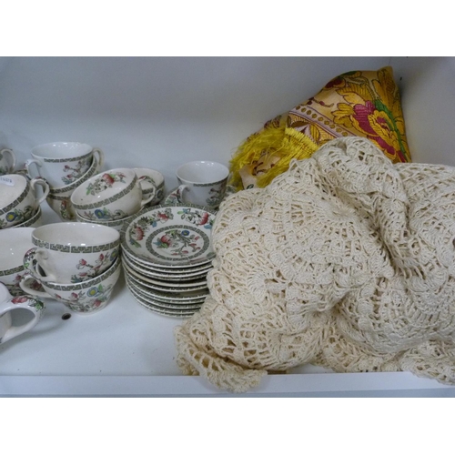 102 - Large quantity of Johnson Bros Indian Tree dinnerwares, also an Indian tablecloth (three shelves).
