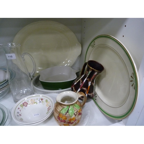 110 - Glass jug, jelly mould, dishes, chopping board, glass Pyrex-style dishes, art pottery jug, ashet etc... 