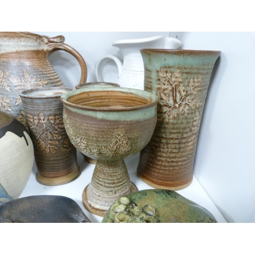 115 - Collection of art pottery including vases, some marked to the underside, German-style jugs, modern m... 