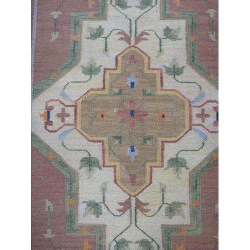 128 - Indian style Floral decorated wool rug.