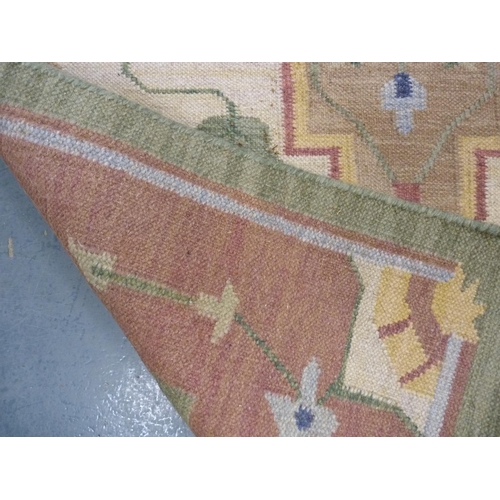 128 - Indian style Floral decorated wool rug.