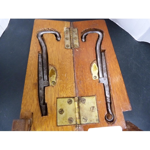 157 - Boot puller in wood case.