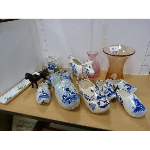 184 - Collection of Delft-style china including clogs, cow creamer, Caithness-style glass vase, amber-colo... 