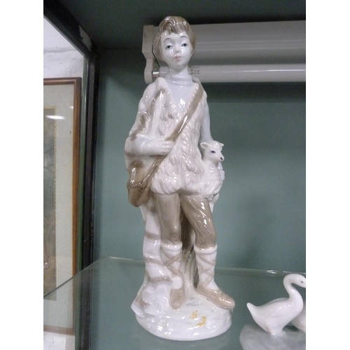 206 - Porcelain figure groups including a figure of a shepherd boy, Nao geese etc.&nbsp; (3)