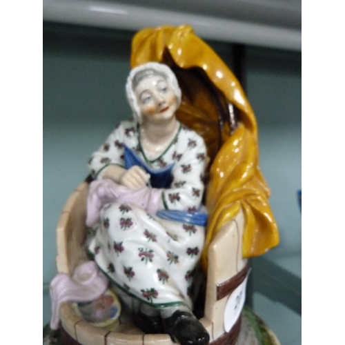 209 - Meissen-style porcelain figure group modelled as a seated lady sewing (a/f).