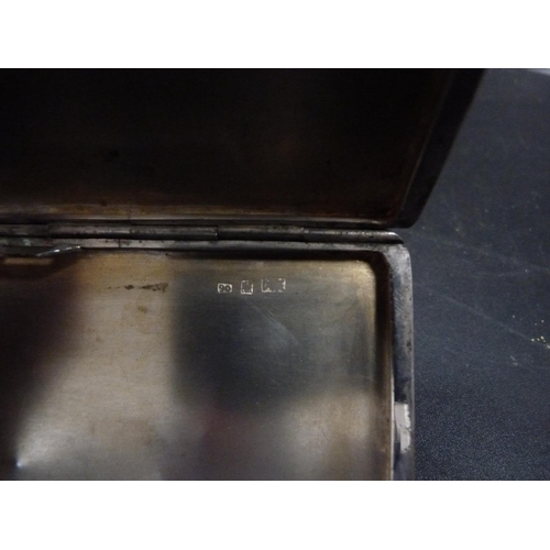 218 - Silver cigarette box and a silver cigarette case decorated with an etched dragon.