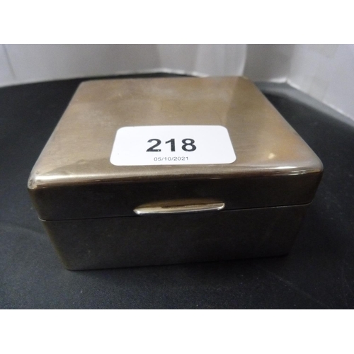 218 - Silver cigarette box and a silver cigarette case decorated with an etched dragon.