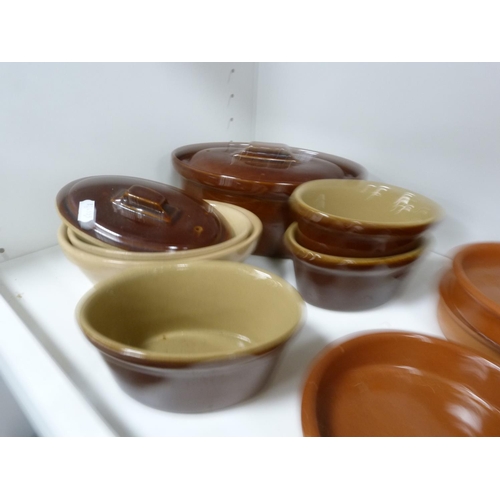 75 - Collection of stoneware tureens and kitchenware including tagine, pots, casserole dishes, cake stand... 