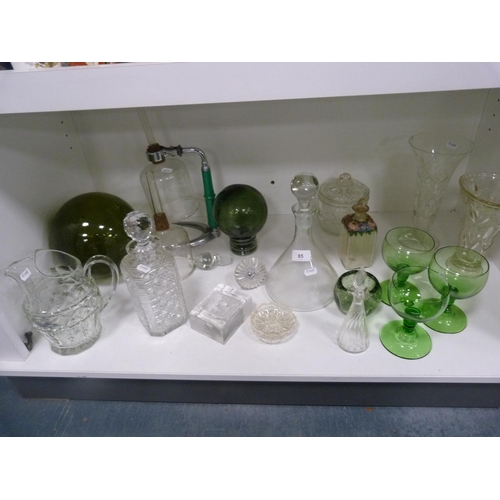 85 - Decanters, green glasses, perfume bottle with stopper, jug, ashtray, green glass float, spare decant... 