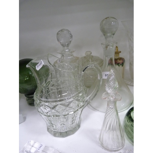 85 - Decanters, green glasses, perfume bottle with stopper, jug, ashtray, green glass float, spare decant... 