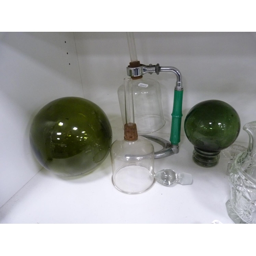 85 - Decanters, green glasses, perfume bottle with stopper, jug, ashtray, green glass float, spare decant... 