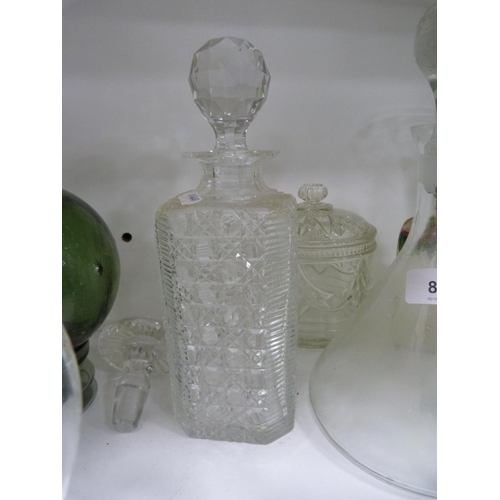 85 - Decanters, green glasses, perfume bottle with stopper, jug, ashtray, green glass float, spare decant... 