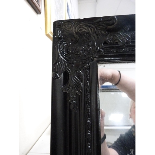 86 - Ebonised wall mirror and a gilt wall mirror.