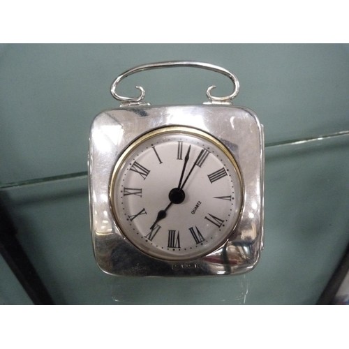 223 - Silver-mounted desk clock with quartz movement, by Walker & Hall, Sheffield, on an easel support... 