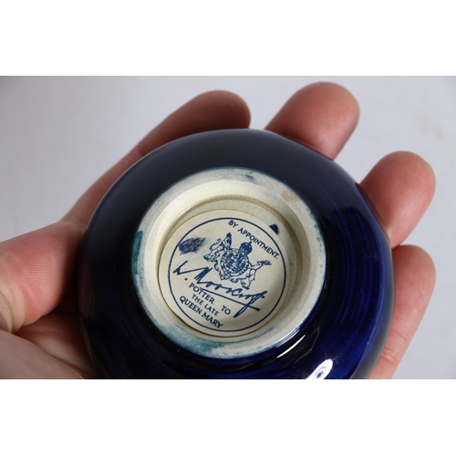 37 - Moorcroft blue ground dish with label to reverse, 8cm diameter.