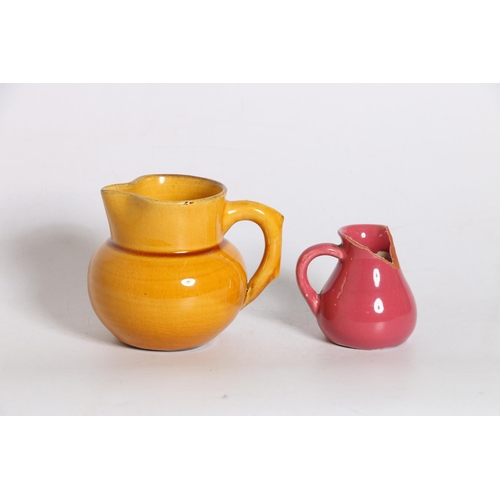 46 - C.H. Brannam Pottery yellow glaze jug, 9cm tall and another. (2) (a/f)