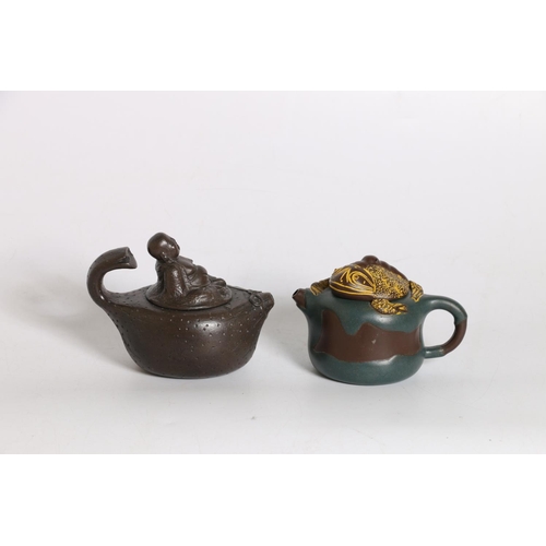 55 - Two Yixing clay teapots, one with frog lid, 9cm tall and another with Buddha lid, 10cm tall. (2)