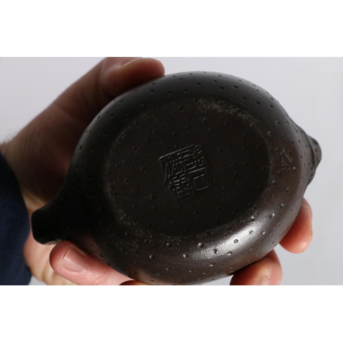 55 - Two Yixing clay teapots, one with frog lid, 9cm tall and another with Buddha lid, 10cm tall. (2)