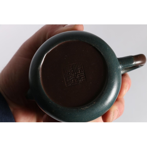 55 - Two Yixing clay teapots, one with frog lid, 9cm tall and another with Buddha lid, 10cm tall. (2)