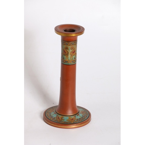 59 - Terracotta pottery candlesticks in the manner of Pratt Ware, 21cm tall.
