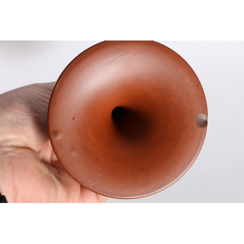 59 - Terracotta pottery candlesticks in the manner of Pratt Ware, 21cm tall.