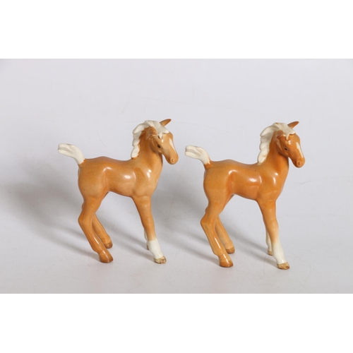 7 - Two Beswick models of light brown foals. (2)