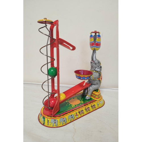 33 - Three German vintage mechanical clockwork circus themed tin toys by Josef Wagner to include a ferris... 