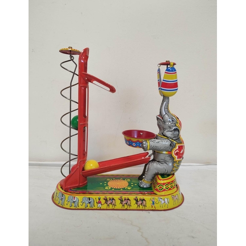 33 - Three German vintage mechanical clockwork circus themed tin toys by Josef Wagner to include a ferris... 