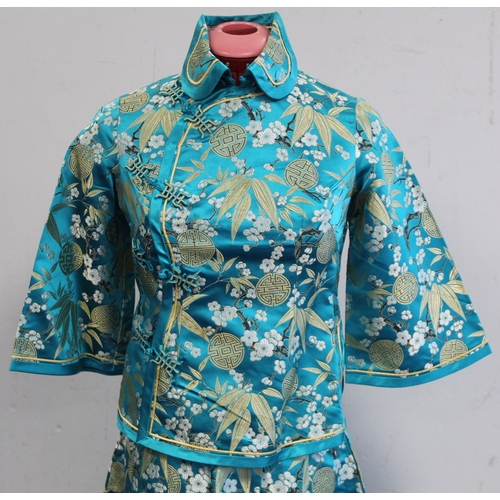 463 - Vintage Chinese lady's jacket in turquoise floral brocade with red piping, retailed by Debenham and ... 