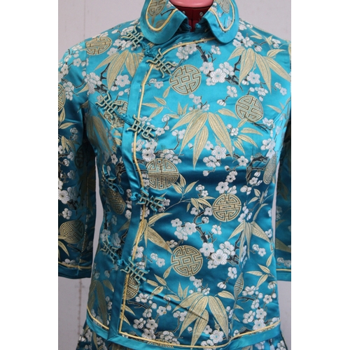 463 - Vintage Chinese lady's jacket in turquoise floral brocade with red piping, retailed by Debenham and ... 