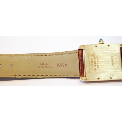 127 - Cartier 18ct gold Tank wristwatch, quartz, with date, 460442WX 2441, on strap with Cartier 18ct gold... 